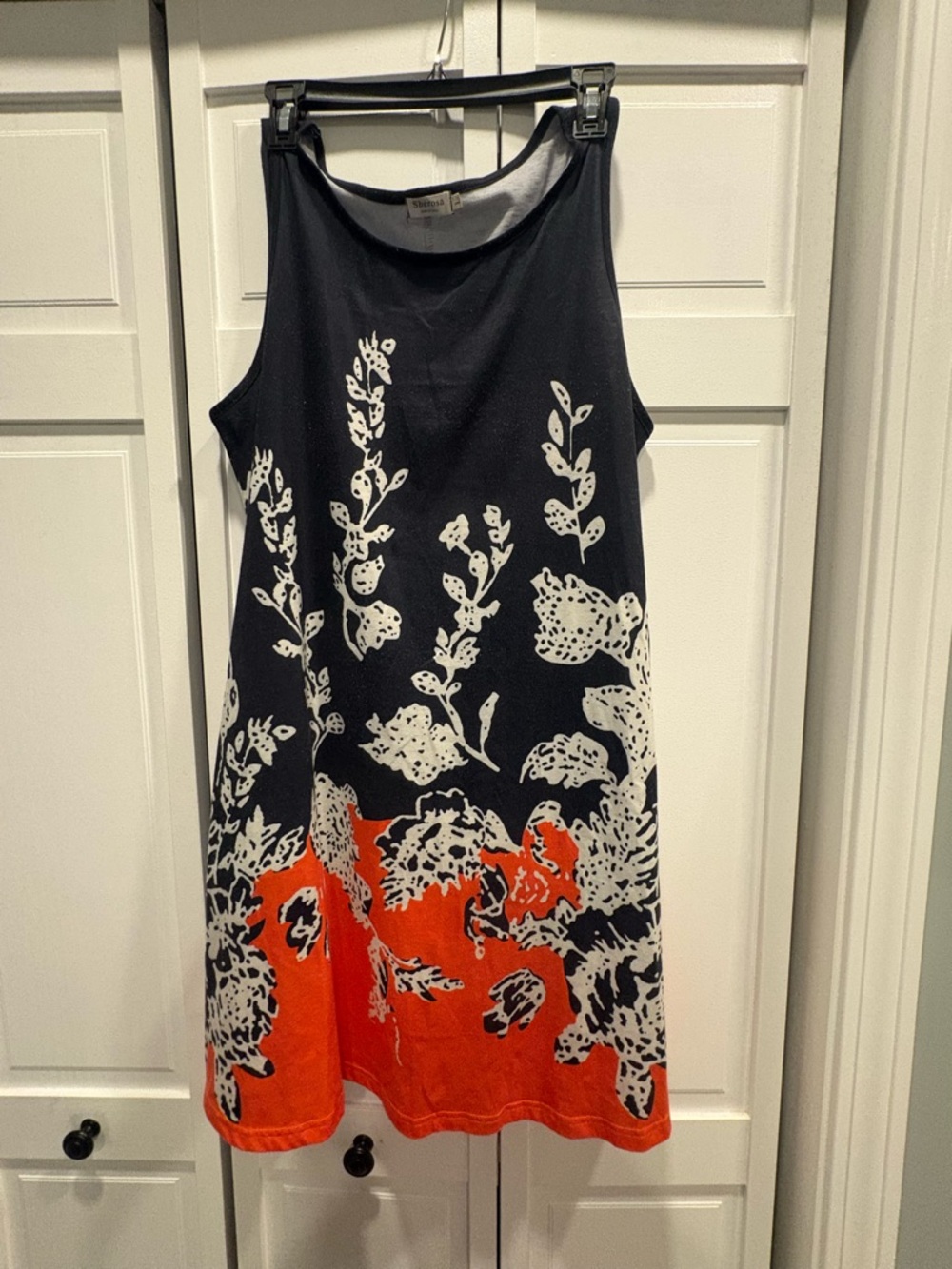 Sleeveless Black Floral Mini Dress with Orange Hem